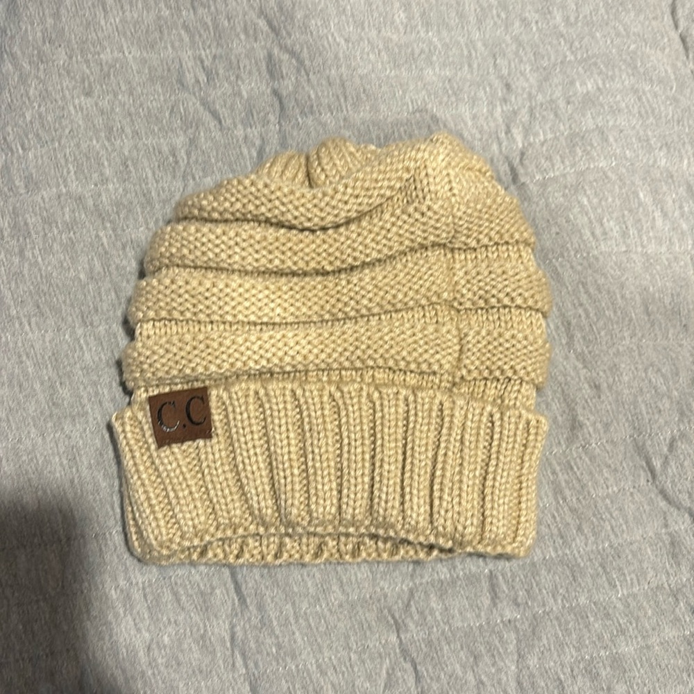 2 for 1 deal!! Tan and black CC beanies only worn once!!